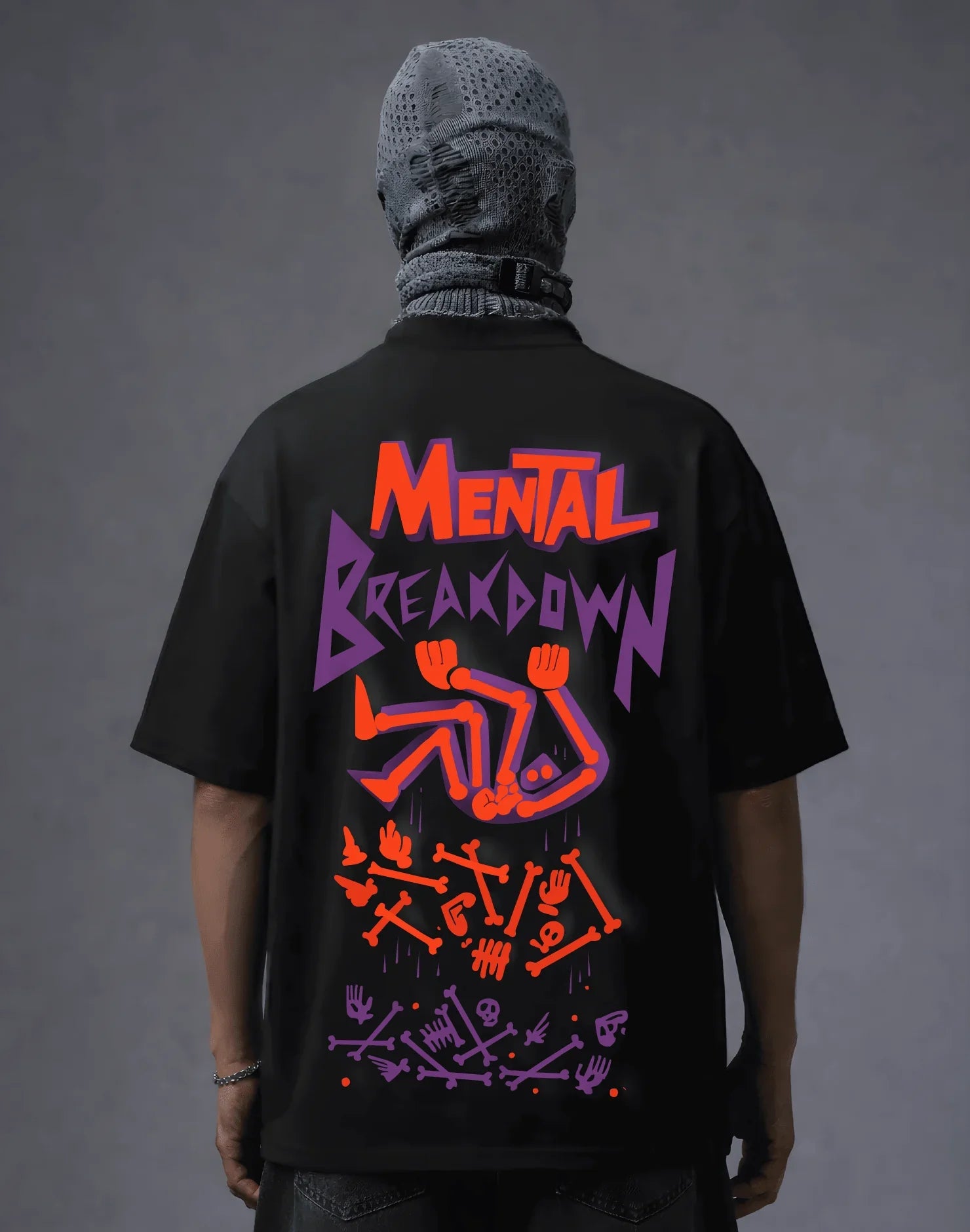 Black graphic tee with 'Mental Breakdown' print, bold orange and purple skeleton design, streetwear style