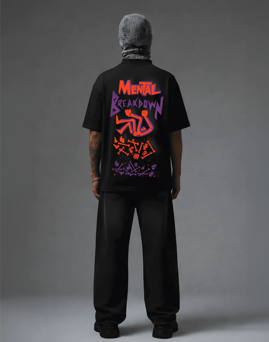 Black graphic tee with 'Mental Breakdown' print, streetwear style, bold orange and purple design