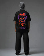 Black graphic tee with 'Mental Breakdown' print, streetwear style, bold orange and purple design