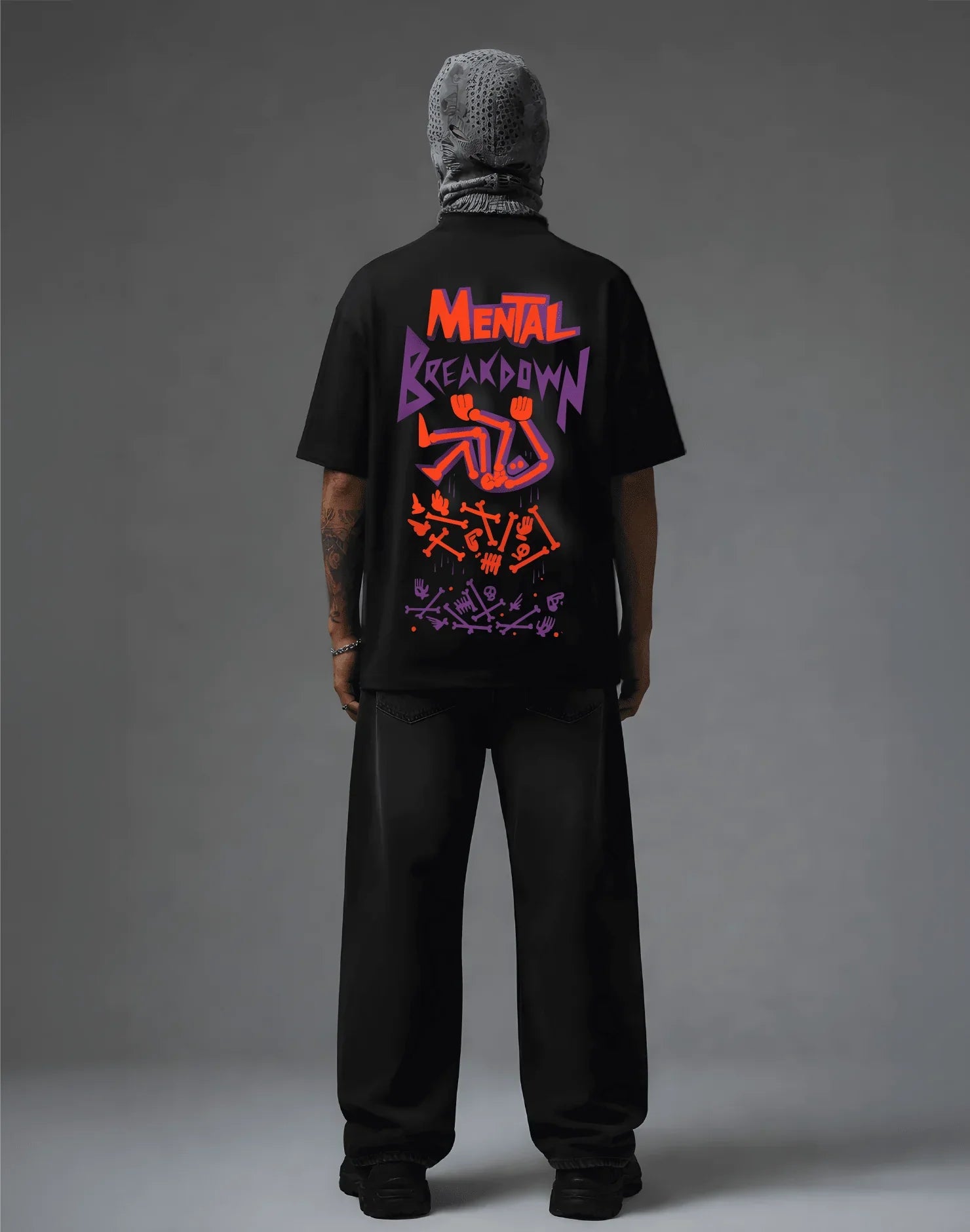 Black graphic tee with 'Mental Breakdown' print, streetwear style, bold orange and purple design